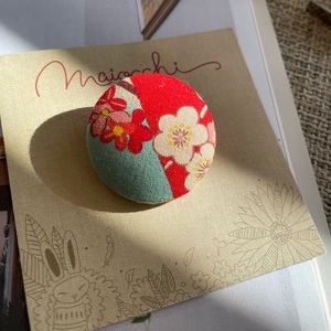 Brooch never taken off this original packaging or worn